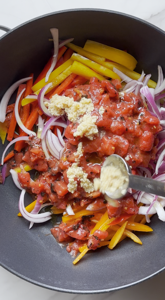 sliced bell peppers and onions and tomatoes, oil, garlic, 